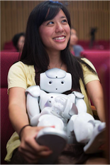 Angelica Lim with robot. Photo credit: https://angelicalim.com.